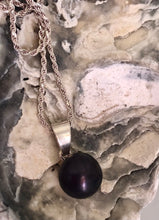 Pérola negra → mistério, transformação e força interior.